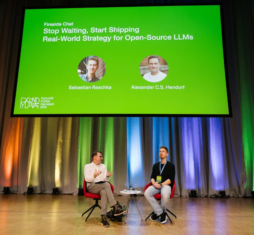 Bühnen-Setup zum Fireside Chat „Stop Waiting, Start Shipping — Real-World Strategy for Open-Source LLMs" mit Sebastian Raschka und Alexander C. S. Hendorf, PyCon DE & PyData 2026