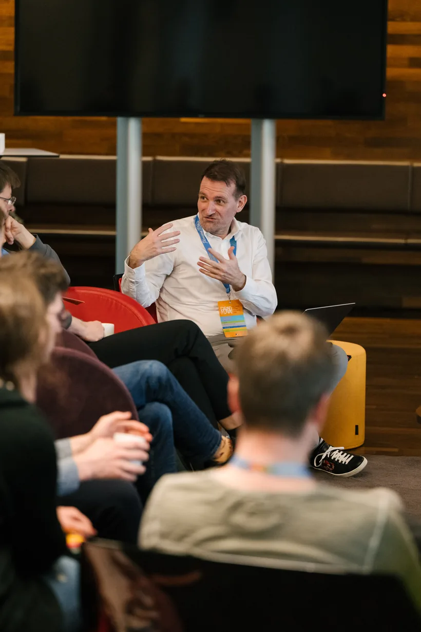 Alexander C. S. Hendorf in discussion with practitioners from five regulated industries during the Problem Clinic, PyCon DE & PyData 2026, Darmstadt